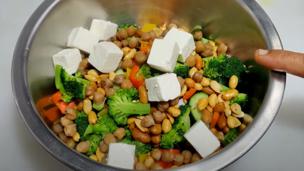 Mixing of the ingredients for Paneer Salad